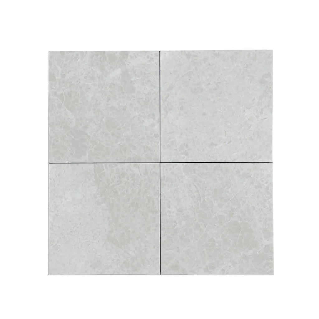 Four light gray stone tiles from White Pearl Botticino Beige Marble collection