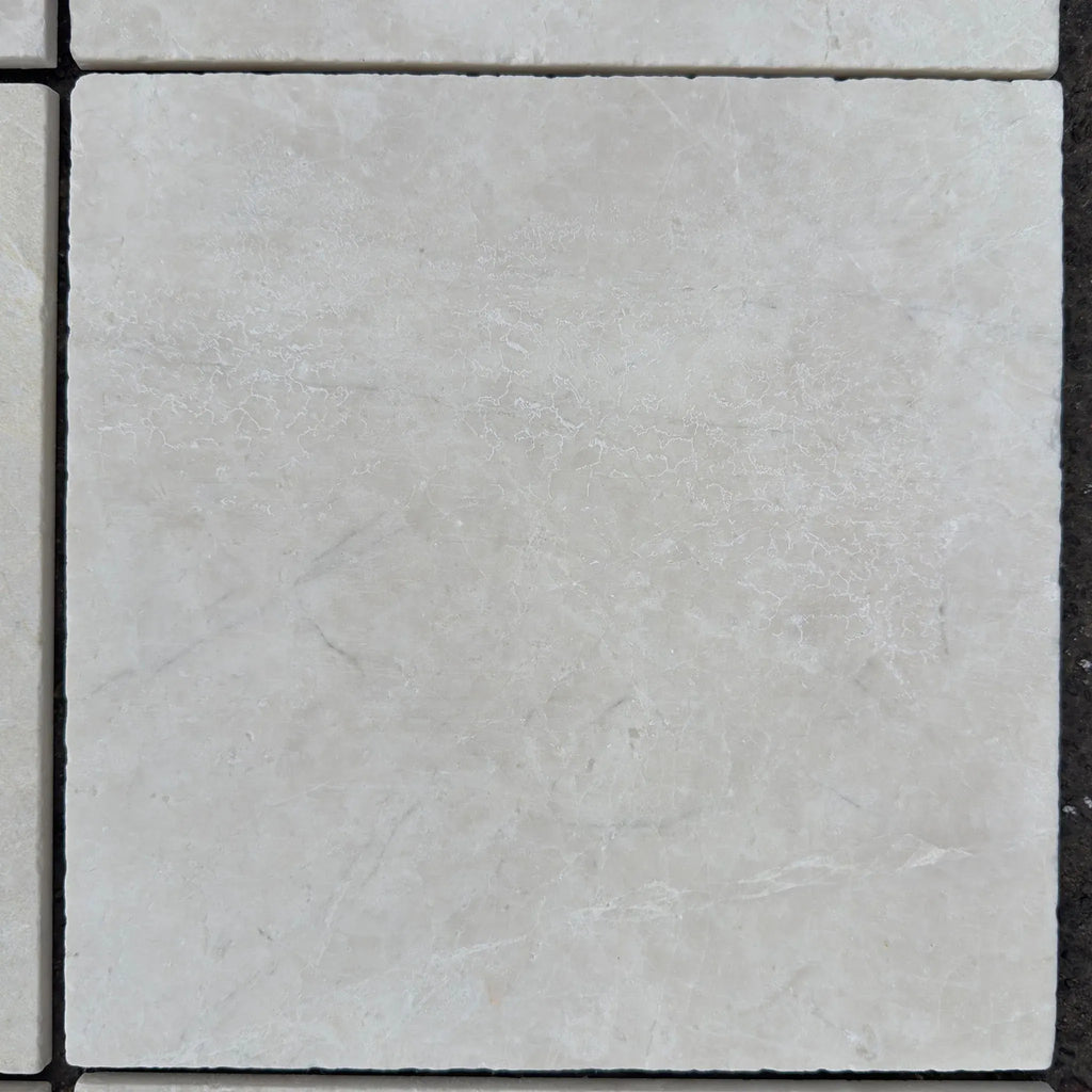 Square marble tile in White Pearl and Botticino Beige Tumbled finish, 12X12 size