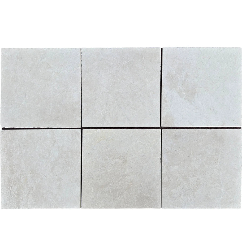 Light-colored tiles with dark grout from White Pearl/Botticino Beige Marble collection