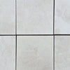 Light-colored square tiles of White Pearl/Botticino Beige Marble 12X12 Tumbled