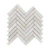 Light-colored herringbone tiles in White Pearl/Botticino Beige Marble mosaic design