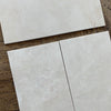 Rectangular light-colored marble tiles from White Pearl/Botticino Beige collection