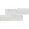 Four rectangular white tiles of White Pearl Botticino Beige Marble 3X6 Tumbled