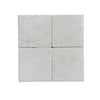 Four light gray tiles from White Pearl/Botticino Beige Marble 4X4 Tumbled collection