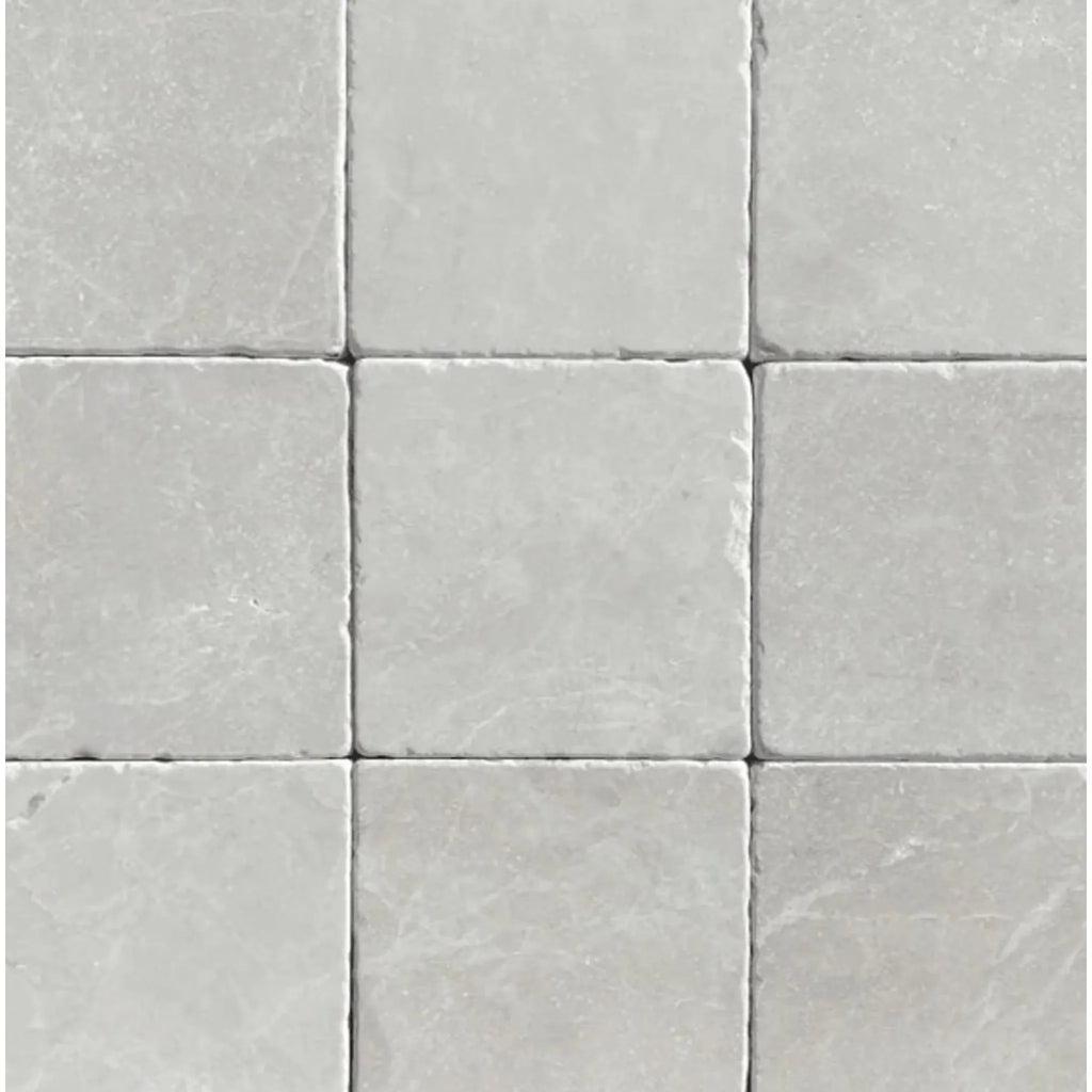 Square gray stone tiles from the White Pearl/Botticino Beige Marble collection