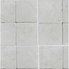 Arrangement of light gray square tiles from White Pearl/Botticino Beige Marble 6X6 Tumbled